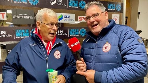 Shelbourne F.C. kit man Johnny Watson playfully pretends to interview friend and fellow club volunteer Jack Kennerk inside Tolka Park stadium in Drumcondra, Ireland, Aug. 23, 2024. Drumcondra is a suburb of Dublin. (AJC photo by Ken Sugiura)