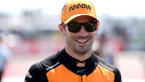 FILE - Alexander Rossi walks to driver introductions before an IndyCar auto race, Sunday, July 14, 2024, at Iowa Speedway in Newton, Iowa. (AP Photo/Charlie Neibergall, File)