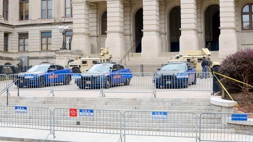 Georgia State Patrol officers and Georgia Army National Guard soldiers are seen at the Washington Street entrance of the state Capitol on Saturday, January 16, 2021, in Atlanta. (Photo: Daniel Varnado for The Atlanta Journal-Constitution)