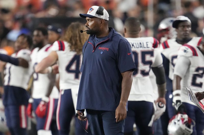 New England Patriots head coach Jerod Mayo watches from the sideline during the first half of a preseason NFL football game against the Washington Commanders, Sunday, Aug. 25, 2024, in Landover, Md. (AP Photo/George Walker IV)