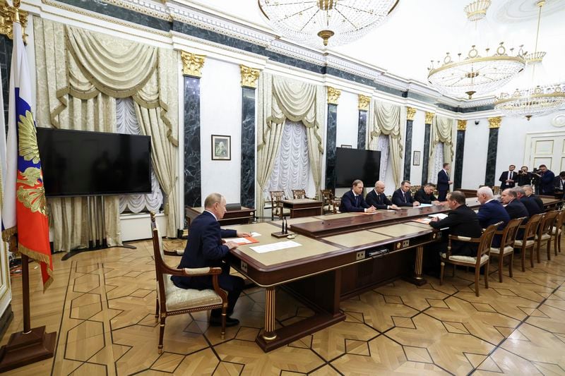 Russian President Vladimir Putin, left, speaks at the Security Council meeting on nuclear deterrence at the Kremlin (Alexander Kazakov, Sputnik, Kremlin Pool Photo via AP)