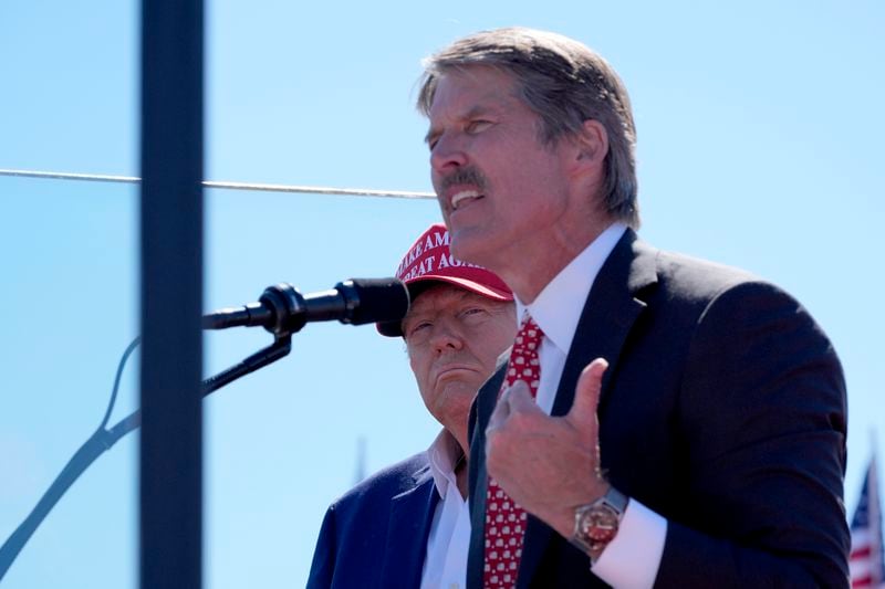 Republican presidential nominee former President Donald Trump, left, listens as Republican Senate candidate Eric Hovde speaks during a campaign event at Central Wisconsin Airport, Saturday, Sept. 7, 2024, in Mosinee, Wis. (AP Photo/Alex Brandon)