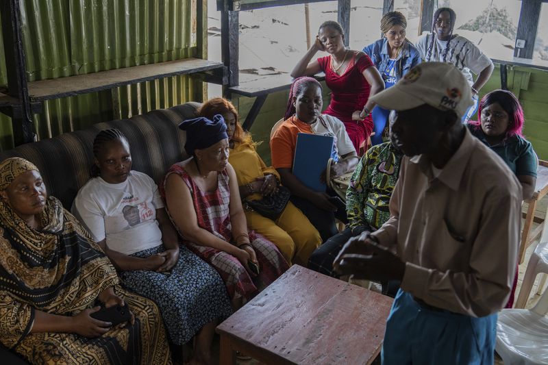 Sex workers participate in an mpox awareness program Wednesday, Sept. 4, 2024 in Kamituga, eastern Congo. (AP Photo/Moses Sawasawa)