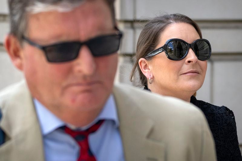 Kellye SoRelle, former general counsel for the Oath Keepers, right, and her attorney Horatio Aldredge leave federal court in Washington, Wednesday, Aug. 21, 2024. (AP Photo/Mark Schiefelbein)