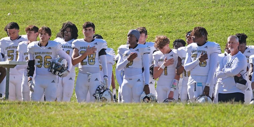 The Apalachee players say the pledge before the game.
Apalachee High School returned to the field against Athens Clarke Central Saturday September 28, 2024 in their first game since the school schooting earlier in the month.

 Nell Carroll for the Journal Constitution