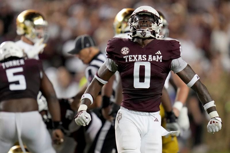 Texas A&M linebacker Scooby Williams (0) reacts after Notre Dame came up short on a fourth down play during the fourth quarter of an NCAA college football game Saturday, Aug. 31, 2024, in College Station, Texas. (AP Photo/Sam Craft)