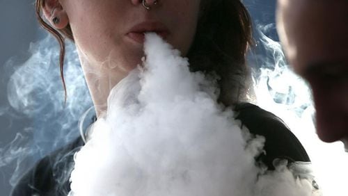 Johns Creek has approved a zoning amendment that seeks to restrict the sale of vape juice and vaping-related products in local stores. AJC FILE