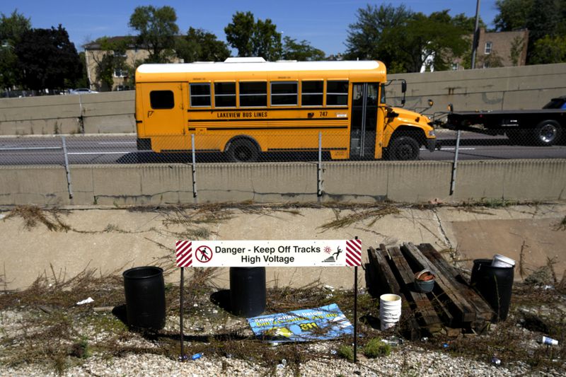 Traffic on the Eisenhower Expressway passes the Chicago Transit Authority Blue Line Harlem Ave., train station Tuesday, Sept. 3, 2024, in Forest Park, Ill. (AP Photo/Charles Rex Arbogast)