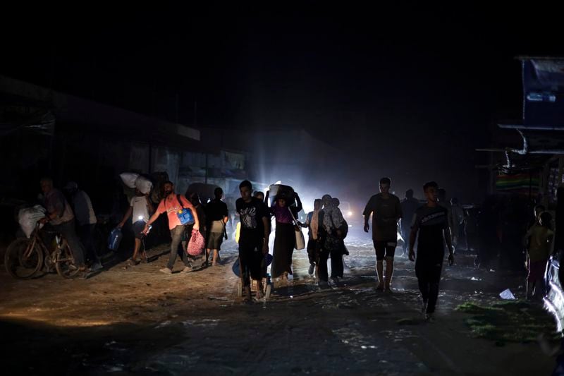 Palestinians displaced by the Israeli air and ground offensive on the Gaza Strip flee from parts of Khan Younis following an evacuation order by the Israeli army to leave the eastern part of Gaza Strip's second largest city on Monday, July 1, 2024. (AP Photo/Jehad Alshrafi)