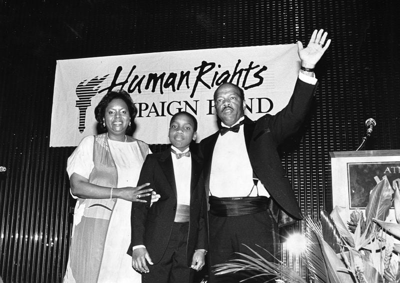 In this 1988 photo, U.S. Rep. John Lewis, with his wife Lillian and son John-Miles (then 11), is honored at a fundraiser for the Human Rights Campaign Fund.