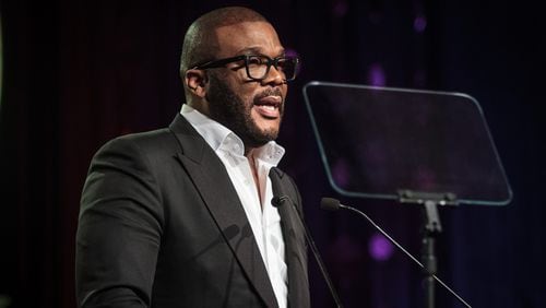 Actor and producer Tyler Perry talks to a large crowd gathered for the Candle In The Dark Gala, celebrating the 150th anniversary of Morehouse College in Atlanta Ga February 18, 2017. Perry was awarded the Bennie and Candle award during the gala. STEVE SCHAEFER / SPECIAL TO THE AJC