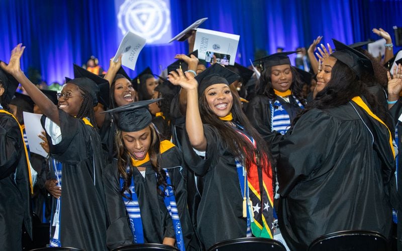 Ariana Williams waves to her family during Spelman College’s 137th commencement on Sunday, May 19, 2024. (Jenni Girtman for The Atlanta Journal-Constitution)