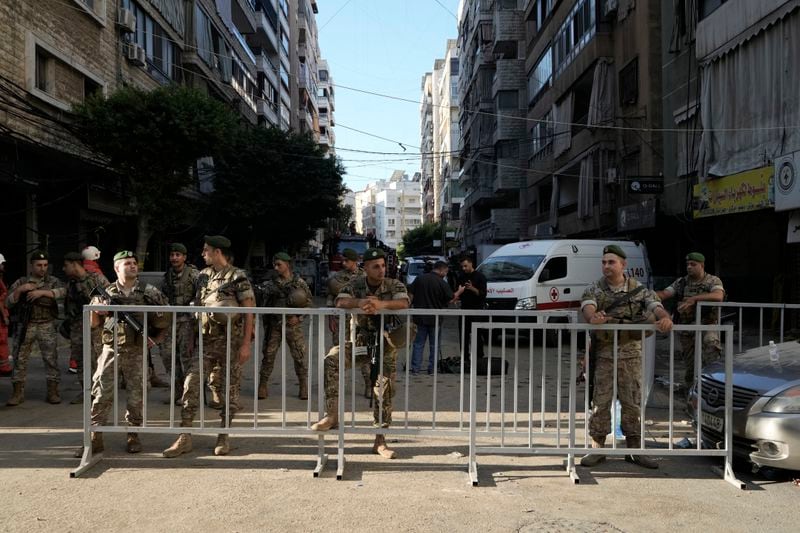 Lebanese soldiers secure the area a day after an Israeli missile strike in Beirut's southern suburbs, Saturday, Sept. 21, 2024. (AP Photo/Bilal Hussein)