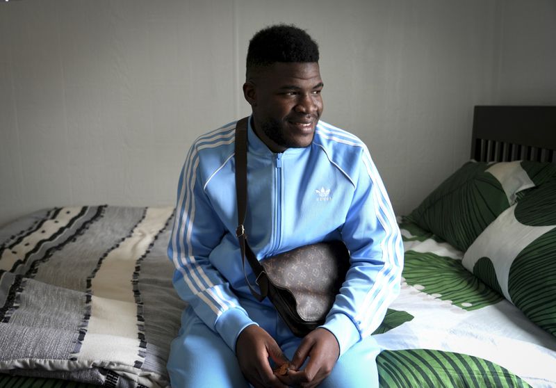 Cabrel Ngougou, a refugee from Cameroon, poses for a photo in San Francisco Tuesday, Sept. 17, 2024. (AP Photo/Terry Chea)