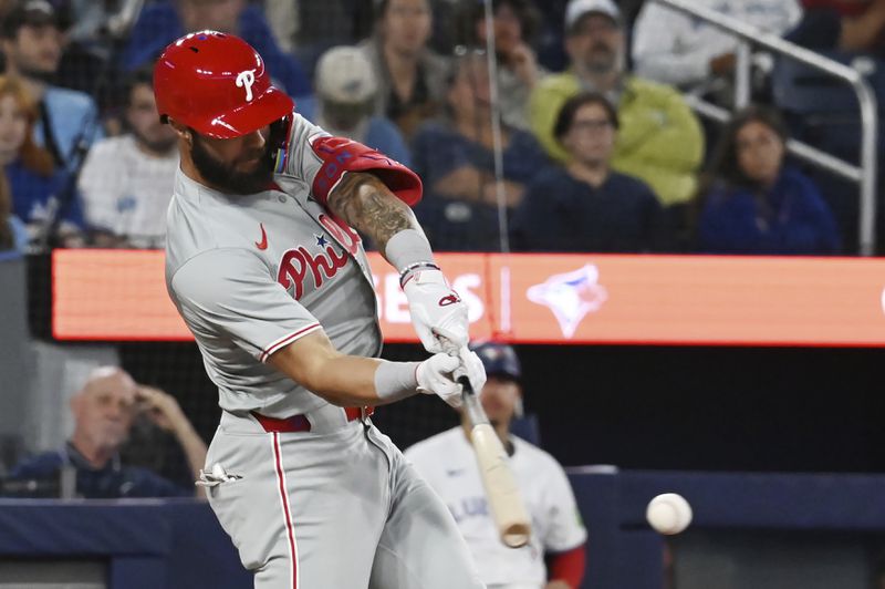 Philadelphia Phillies' Weston Wilson (37) hits a single in the ninth inning of a baseball game against the Toronto Blue Jays in Toronto on Tuesday, Sept. 3, 2024. (Jon Blacker/The Canadian Press via AP)