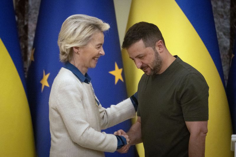 Ukrainian President Volodymyr Zelenskyy, right, and European Commission President Ursula von der Leyen greet each other in Kyiv, Ukraine, Friday, Sept. 20, 2024. (AP Photo/Efrem Lukatsky)