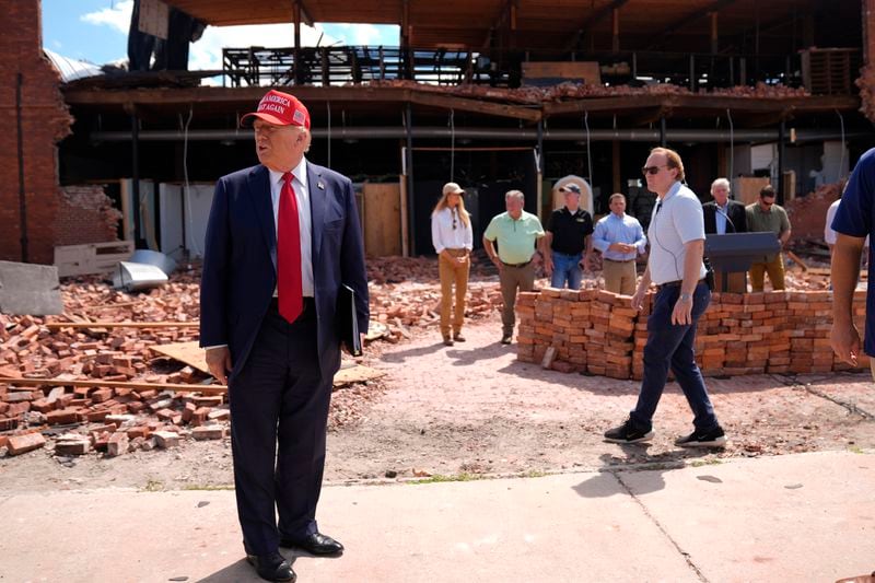 Republican presidential nominee former President Donald Trump tours downtown Valdosta, Ga., a town that was impacted by Hurricane Helene, Monday, Sept. 30, 2024. (AP Photo/Evan Vucci)