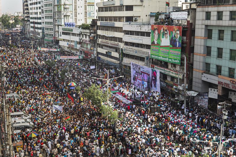 Supporters of the Bangladesh Nationalist Party (BNP) shout slogans during a rally demanding a democratic transition through an election in Dhaka, Bangladesh, Tuesday, Sept.17, 2024. (AP Photo/Rajib Dhar)