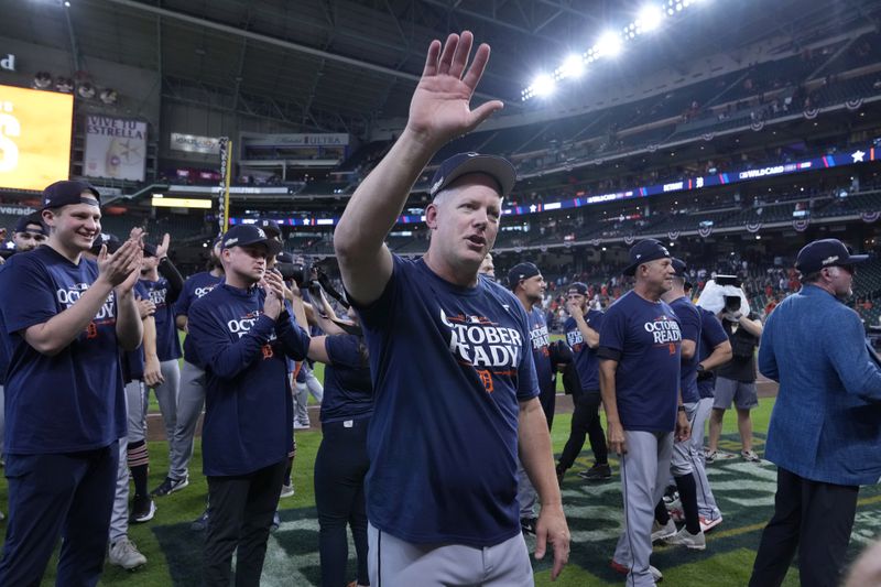 Detroit Tigers manager A.J. Hinch, center, celebrates his team's 5-2 win against the Houston Astros in Game 2 of an AL Wild Card Series baseball game Wednesday, Oct. 2, 2024, in Houston. (AP Photo/Kevin M. Cox)