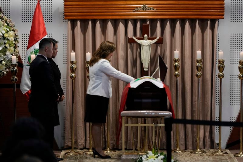 Kenji Fujimori and his sister Keiko look on as Peruvian President Dina Boluarte pays her respects to late former President Alberto Fujimori during his wake in Lima, Peru, Thursday, Sept. 12, 2024. (AP Photo/Guadalupe Pardo)