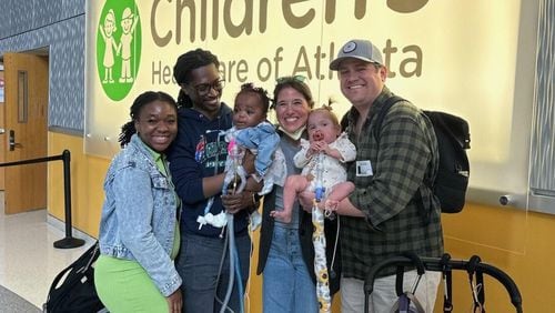 (From left) Love, Teddy and Royal Dacius and Torri, Wynnie and Alex Deason during Royal’s discharge from Scottish Rite Hospital in Sandy Springs. (Courtesy of Children's Healthcare of Atlanta)