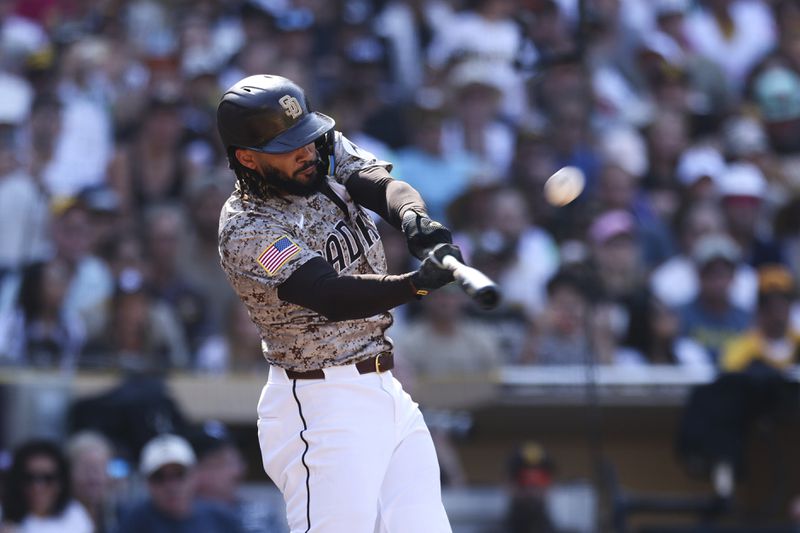 San Diego Padres' Fernando Tatis Jr. hits a solo home run against the Chicago White Sox in the eighth inning of a baseball game, Sunday, Sept. 22, 2024, in San Diego. (AP Photo/Derrick Tuskan)