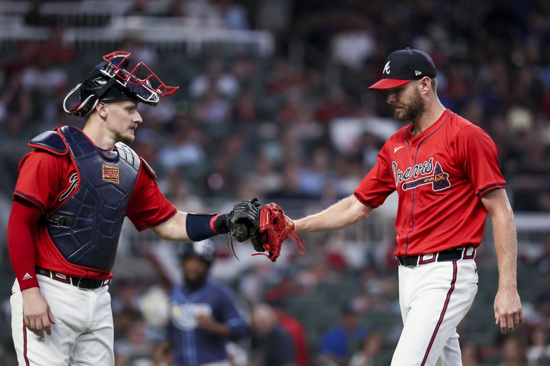Atlanta Braves starting pitcher Chris Sale, right, greets Atlanta Braves catcher Sean Murphy (12) after the final out during the sixth inning against the Tampa Bay Rays at Truist Park, Friday, June 14, 2024, in Atlanta. The Braves won 7-3. (Jason Getz / AJC)
