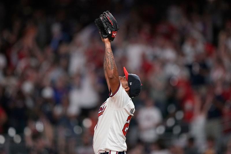 Atlanta Braves pitcher Raisel Iglesias (26) celebrates after a win against the San Francisco Giants, Wednesday, July 3, 2024, in Atlanta. (AP Photo/Brynn Anderson)