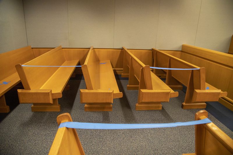 08/24/2020 - Lawrenceville, Georgia - Tape is used to mark off areas of court benches for social distancing in the courtroom of Chief Judge George F. Hutchinson III at the Gwinnett Justice and Administration Center in Lawrenceville, Monday, August 24, 2020. (ALYSSA POINTER / ALYSSA.POINTER@AJC.COM)