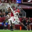 Georgia defensive back Malaki Starks (24) tips as pass against Alabama wide receiver Ryan Williams (2) and Williams eventually caught it after tipping the ball to himself during the second half at Bryant-Denny Stadium, Saturday, Sept. 28, 2024, in Tuscaloosa, Al. Alabama won 41-34. (Jason Getz / AJC)

