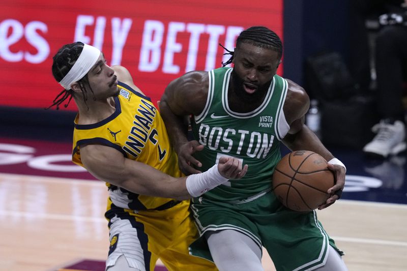 Boston Celtics guard Jaylen Brown drives around Indiana Pacers guard Andrew Nembhard, left, during the first half of Game 3 of the NBA Eastern Conference basketball finals, Saturday, May 25, 2024, in Indianapolis. (AP Photo/Darron Cummings)