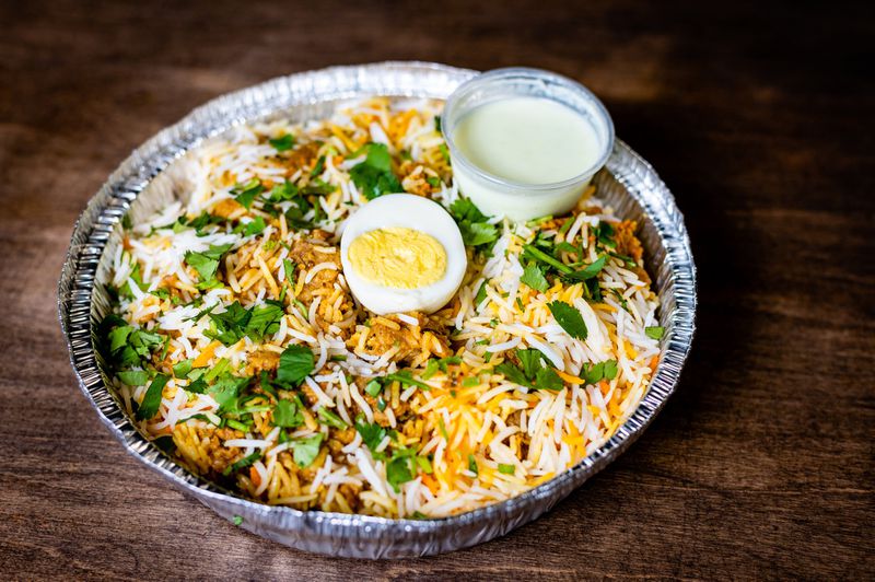 Goat biryani is among the more traditional offerings at Atlanta Halal Meat & Food. CONTRIBUTED BY HENRI HOLLIS