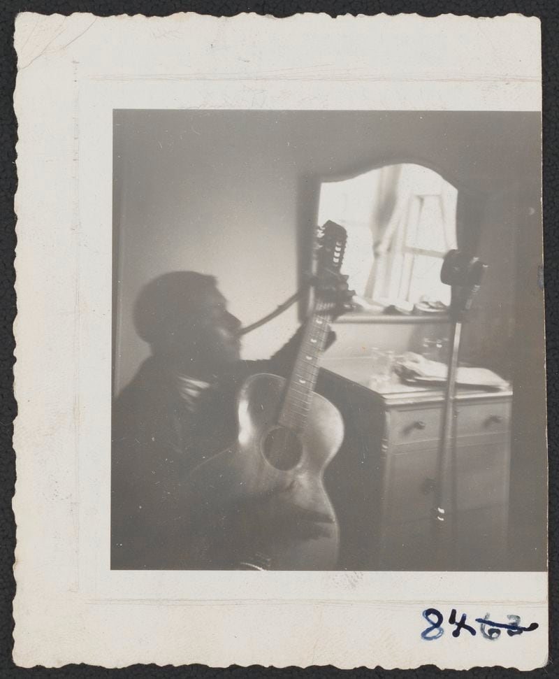 A photo of Blind Willie McTell taken in an Atlanta hotel in November 1940 during a recording session with folklorist Alan Lomax for the Library of Congress.