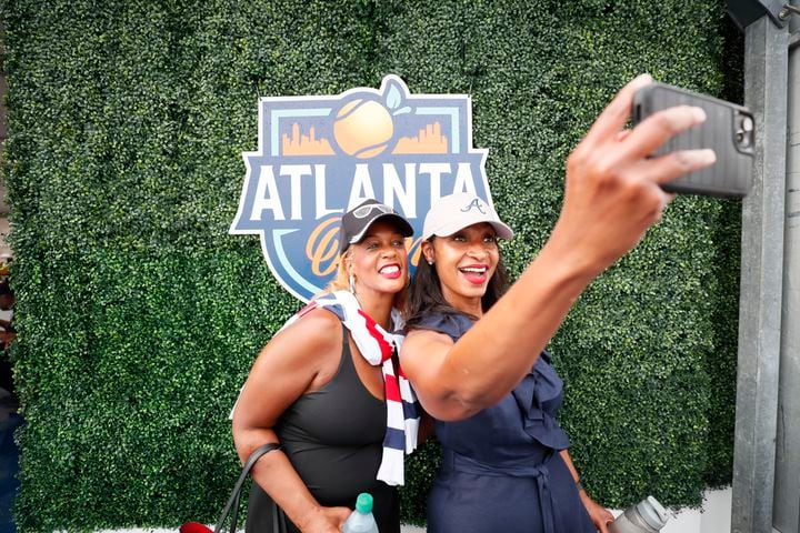 Trei Taylor (left) and Trisha Williams take a selfie as they arrive at the Atlanta Open for an exhibition match between Sloane Stephens and Taylor Townsend at Atlantic Station on Sunday, July 21, 2024.
(Miguel Martinez / AJC)