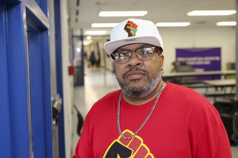 Juan Pullen, parent of two RISE Prep School students, is in the school cafeteria, on Wednesday, Feb. 22, 2023, in East Point, Ga. The RISE Prep and Grammar schools are in jeopardy of being closed by Fulton County Schools. Jason Getz / Jason.Getz@ajc.com)