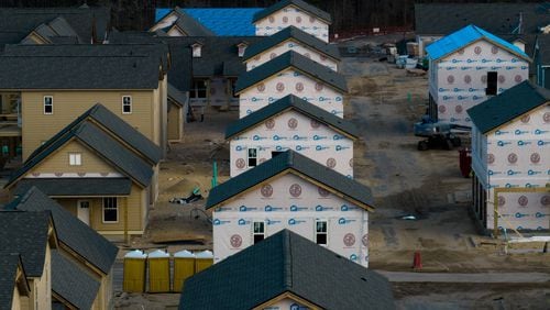 
                        FILE — New homes under construction near the Cape Fear River, in Wilmington, N.C., Feb. 26, 2023. Under pressure to control housing costs, Republican lawmakers in North Carolina rejected standards meant to protect against disasters, experts say. (Erin Schaff/The New York Times)
                      