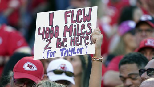 A fan holds a sign meant for Taylor Swift during the first half of an NFL football game between the Kansas City Chiefs and the Los Angeles Chargers Sunday, Oct. 22, 2023, in Kansas City, Mo. (AP Photo/Ed Zurga)