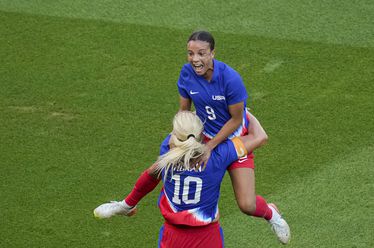 Mallory Swanson, of the United States, top, celebrates with Lindsey Horan, of the United States, after scoring her side's first goal during the women's soccer gold medal match between Brazil and the United States at the Parc des Princes during the 2024 Summer Olympics, Saturday, Aug. 10, 2024, in Paris, France. (AP Photo/Vadim Ghirda)