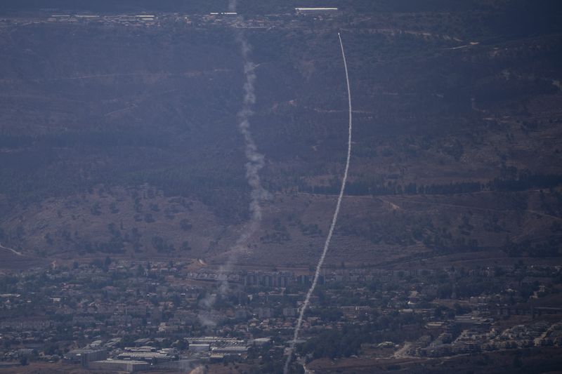 The Israeli Iron Dome air defense system fires to intercept an attack from Lebanon over the Galilee region, near Kiryat Shmona, as seen from the Israeli-annexed Golan Heights, Tuesday, Sept. 17, 2024. (AP Photo/Leo Correa)