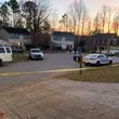 Police investigated the scene of a triple killing in a Gwinnett County neighborhood in November 2020.