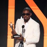 Usher accepts the award for best male R&B/pop artist during the BET Awards on Sunday, June 30, 2024, at the Peacock Theater in Los Angeles. (AP Photo/Chris Pizzello)
