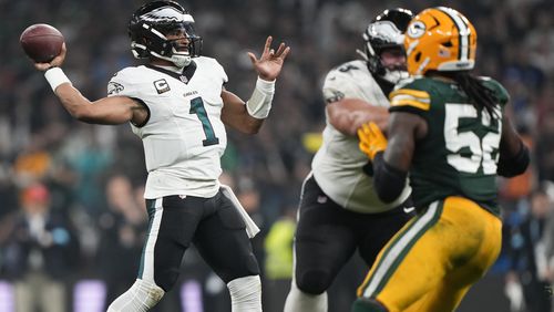 Philadelphia Eagles quarterback Jalen Hurts (1) passes against the Green Bay Packers during the first half of an NFL football game, Friday, Sept. 6, 2024, at the Neo Quimica Arena in Sao Paulo. (AP Photo/Doug Benc)