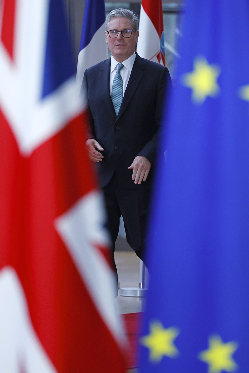 Britain's Prime Minister Keir Starmer, walks with European Council President Charles Michel, at the European Commission headquarters in Brussels, Wednesday, Oct. 2, 2024. (Benjamin Cremel/Pool Photo via AP)