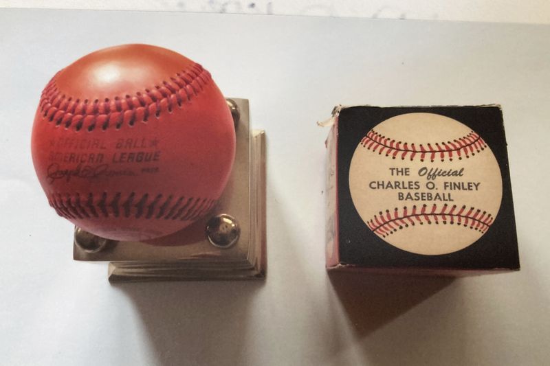 In this undated photo provided by Nancy Finley, one of the orange baseballs that former Oakland A's owner Charles Finley unsuccessfully tried to persuade Major League Baseball to introduce into the game during the 1970s – a period when the team won three consecutive World Series. (Courtesy of Nancy Finley via AP)