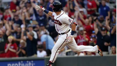 Austin Riley gestures as he rounds the bases after hitting a two-run homer in the first inning of Thursday's game.