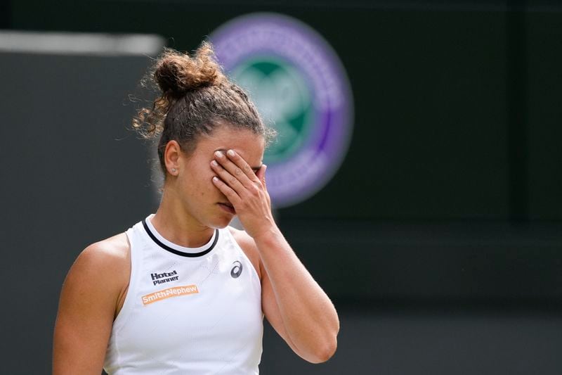 Jasmine Paolini of Italy reacts during her semifinal match against Donna Vekic of Croatia at the Wimbledon tennis championships in London, Thursday, July 11, 2024. (AP Photo/Alberto Pezzali)