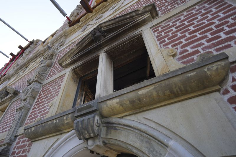 A window, blackened with soot, is seen at Copenhagen's Old Stock Exchange building in Copenhagen, Denmark, Thursday, Sept. 19, 2024. (AP Photo James Brooks)