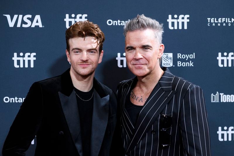 Jonno Davies and Robbie Williams attend the premiere of "Better Man", during the 2024 Toronto International Film Festival, in Toronto on Monday, Sept. 9, 2024. (Christopher Katsarov/The Canadian Press via AP)