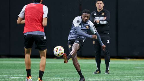 Atlanta United midfielder Derrick Etienne Jr. during training camp as Atlanta United head coach Gonzalo Pineda watches at Mercedes-Benz Stadium, Tuesday, January 16, 2024, in Atlanta.  (Jason Getz / Jason.Getz@ajc.com)