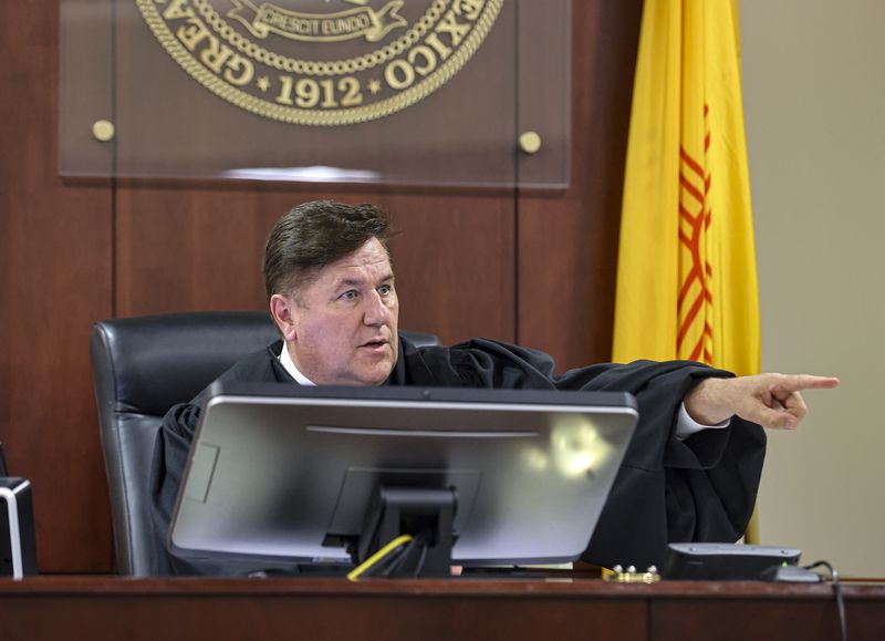 Judge T. Glenn Ellington speaks to Hannah Gutierrez-Reed, the weapons supervisor on the set of the Western film “Rust," and her lawyer Jason Bowles during a plea hearing at the First Judicial District Courthouse in Santa Fe, N.M., Monday, Oct. 7, 2024. (Gabriela Campos/Santa Fe New Mexican via AP, Pool)